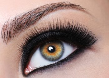 Female eye with bright black make-up and long eyelashes